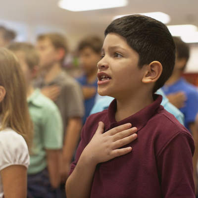 Children reciting Pledge of Allegiance in school